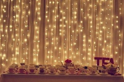Christmas lights behind sheer curtains to give the room a ro... / wedding ideas - Juxtapost